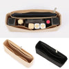 A tan felt handbag organizer insert showing various compartments for pens and small items.