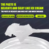 A white paste is shown being smeared onto a surface, highlighting its delicate and silky texture.