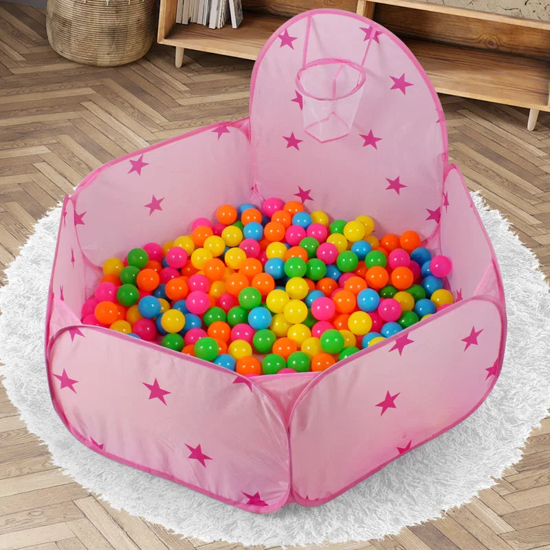 Pink foldable pop-up play tent filled with colorful plastic balls for children
