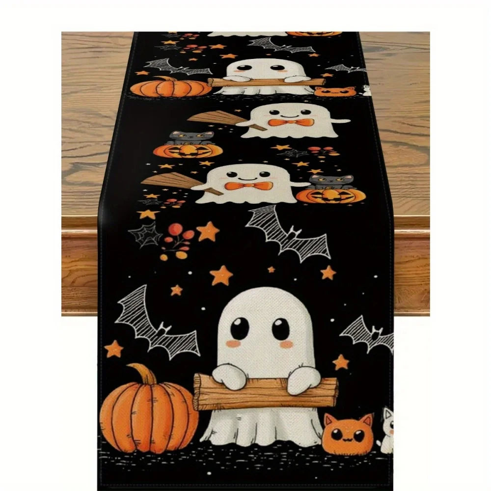 Black Halloween table runner featuring white ghosts, pumpkins, bats, and jack-o'-lanterns