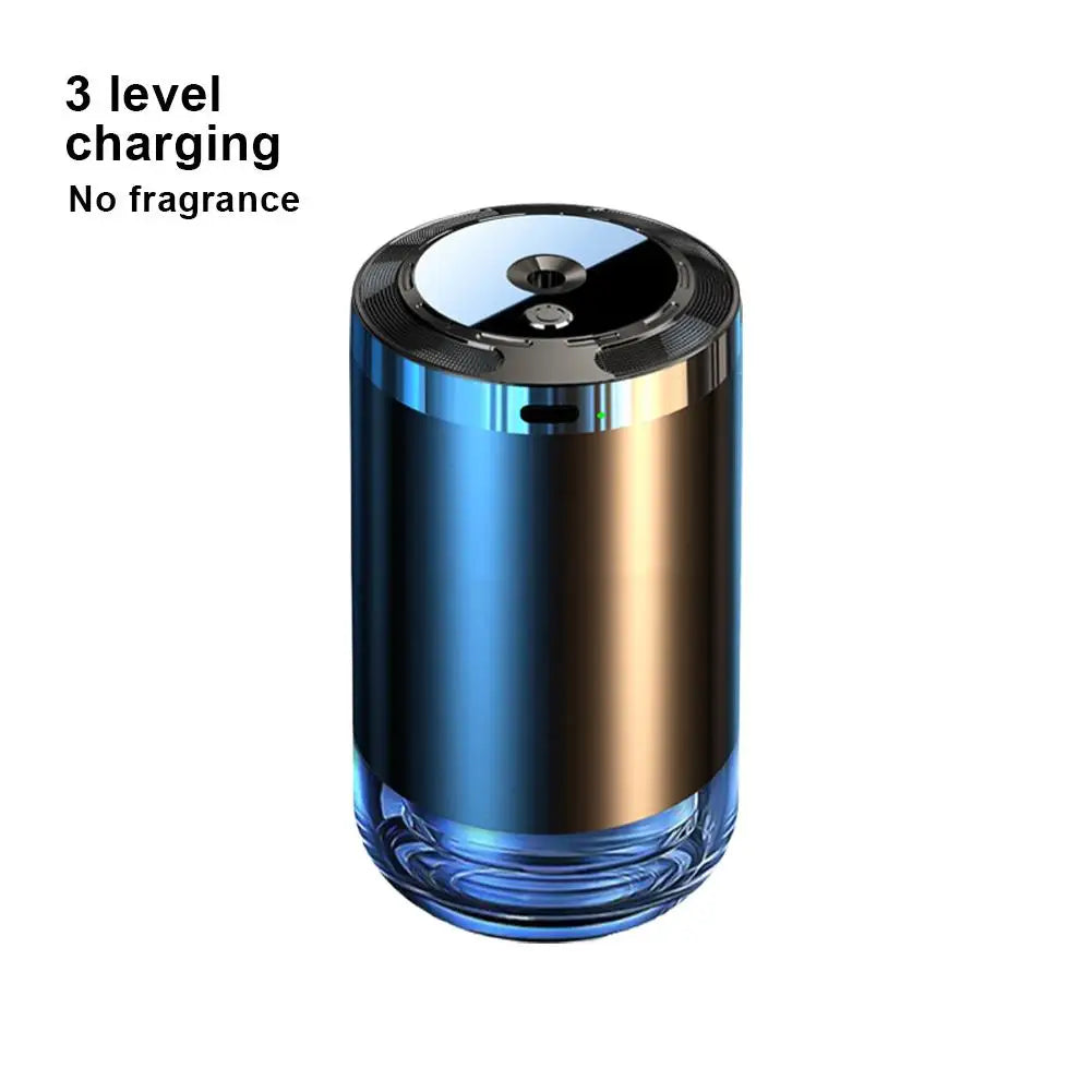 A sleek, cylindrical car aroma diffuser with a metallic finish and a glass base.