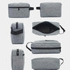 A collection of gray waterproof travel toiletry bags shown in various folded and open configurations.