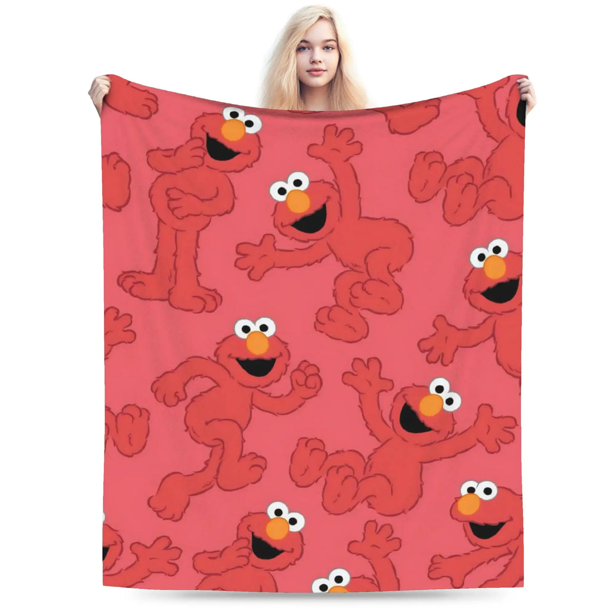 A red flannel throw blanket featuring repeating illustrations of fuzzy orange characters from Sesame Street Friends