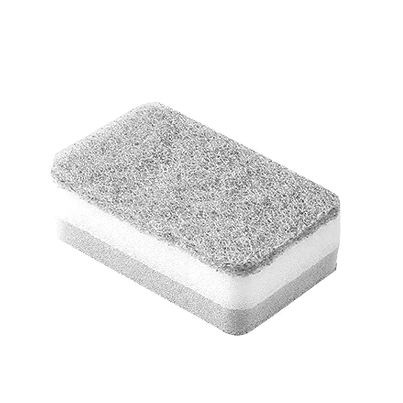A rectangular block of double-sided cleaning sponges with a textured gray top and white foam base.
