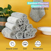 A stack of grey bamboo charcoal cleaning cloths is shown next to a bowl, highlighting their absorbent, soft, and breathable q