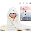 A white hooded baby bathrobe towel with a cat design is displayed next to various colored towels.