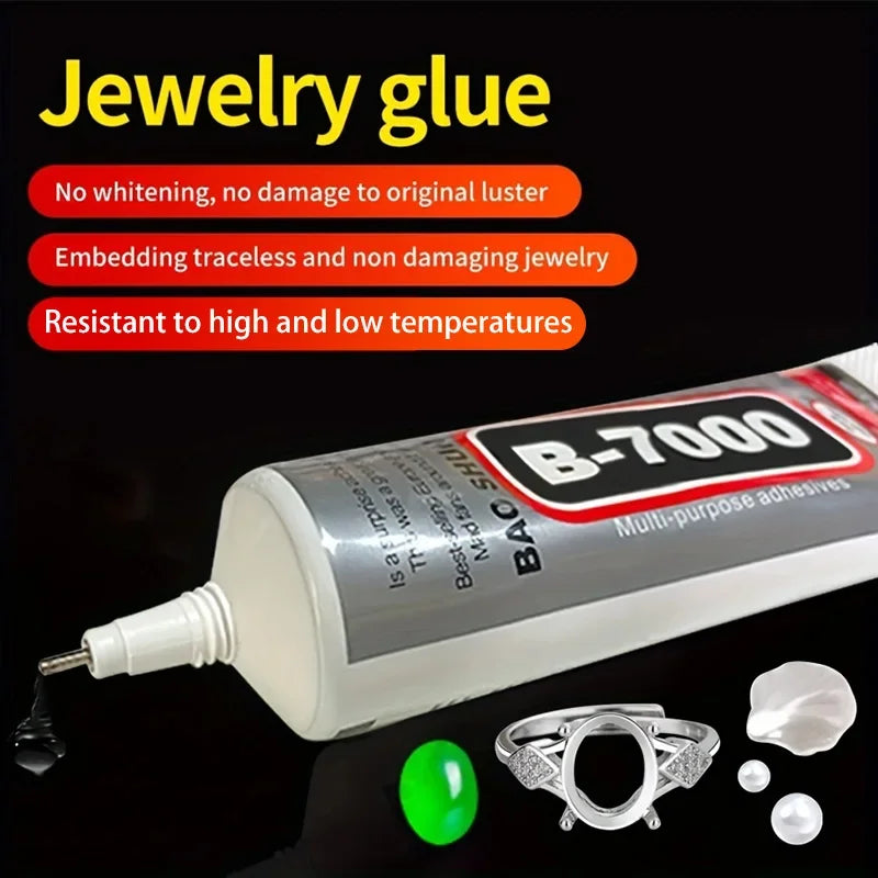 A bottle of B-7000 multi-purpose adhesive glue for jewelry and crafts, with a fine tip and small pieces of silver jewelry.