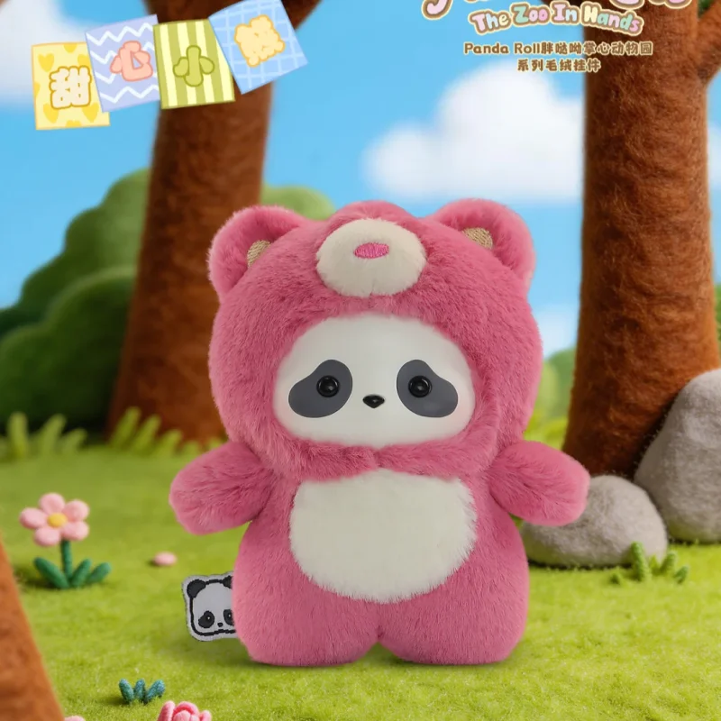 A pink panda plush toy is displayed in a forest setting with tree trunks and green grass.