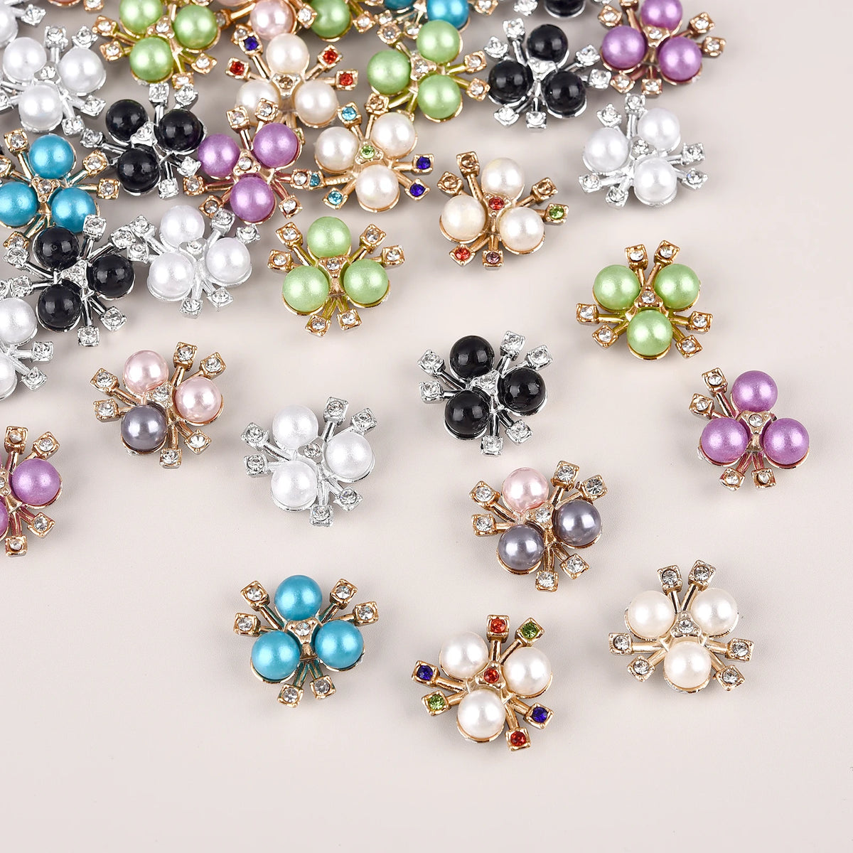 A collection of pearlized resin flower beads in various colors including pink, green, purple, and white.