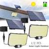 Two solar powered outdoor light fixtures with LED bulbs and a solar panel in daylight.