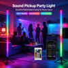 A dynamic RGB ambient lamp used as a party light in a living room setting with people dancing.