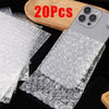 Clear bubble mailers with cushioned protection are shown next to a smartphone.