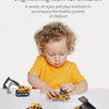 A young child is playing with a set of six die-cast construction truck toys including an excavator, loader, and tractor.