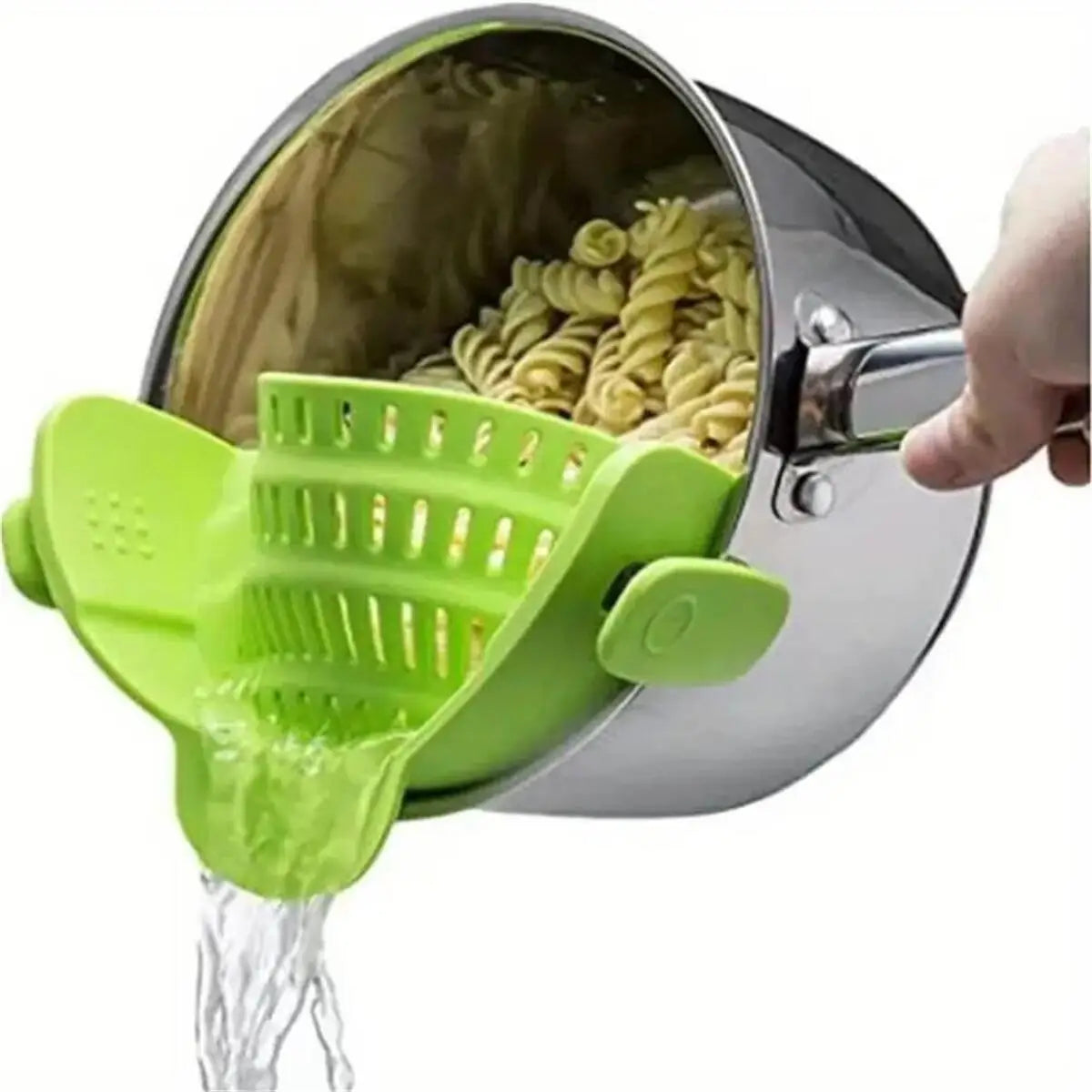 A hand is pouring liquid through a green mesh strainer attached to a stainless steel pot strainer.
