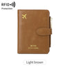 A light brown leather travel wallet featuring an airplane pattern and RFID protection.
