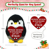 Handmade knitted penguin doll with a heart-shaped card featuring a heartwarming message