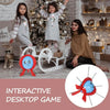 A family strategy game featuring a red balloon burst component and decorative elements in a festive setting.