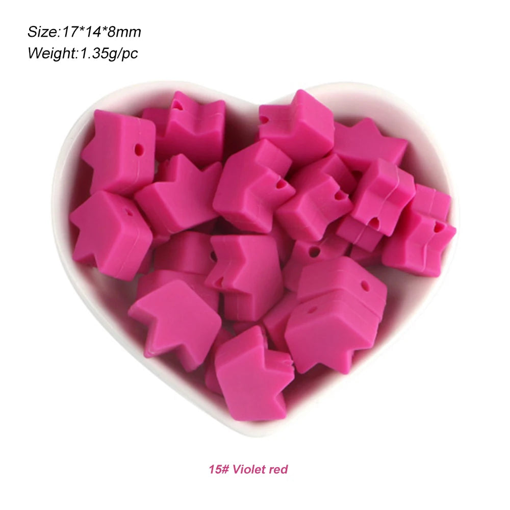 A pile of pink silicone crown star heart beads for DIY jewelry making