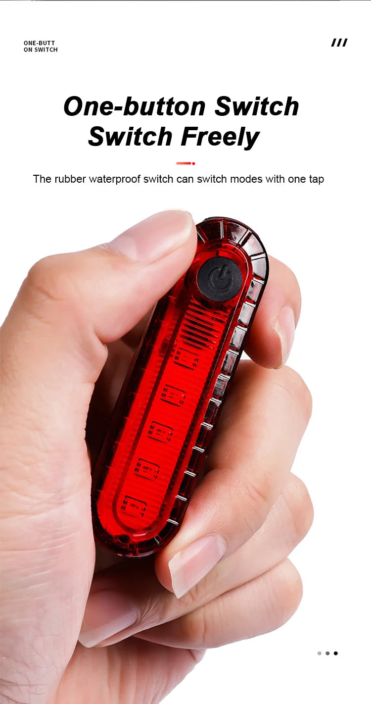 A hand holds a red rubber waterproof one-button switch light device.