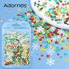 A clear plastic container filled with colorful star sequins is shown next to a white surface covered in scattered confetti.