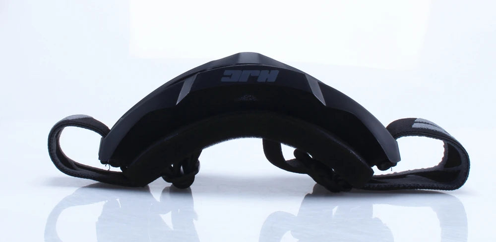 Black retro motorcycle sunglasses with night vision lenses displayed on a reflective surface.