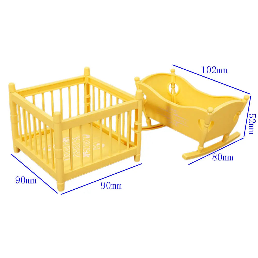 Yellow fashion doll accessories set featuring a wooden crib and a saddle