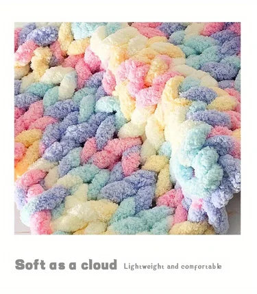 A close-up of multicolored fluffy chenille yarn in various pastel shades like pink, yellow, blue, and purple.
