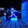 A glowing blue 3D illusion sports night light shaped like a figure on a circular base.