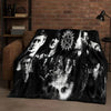 A dark flannel throw blanket featuring a collage of faces and symbols inspired by the Supernatural TV show.