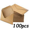 A stack of brown kraft paper envelopes for invitations, letters, and mailing.