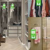 A closet interior showing hanging moisture absorber bags for clothes and cabinets.