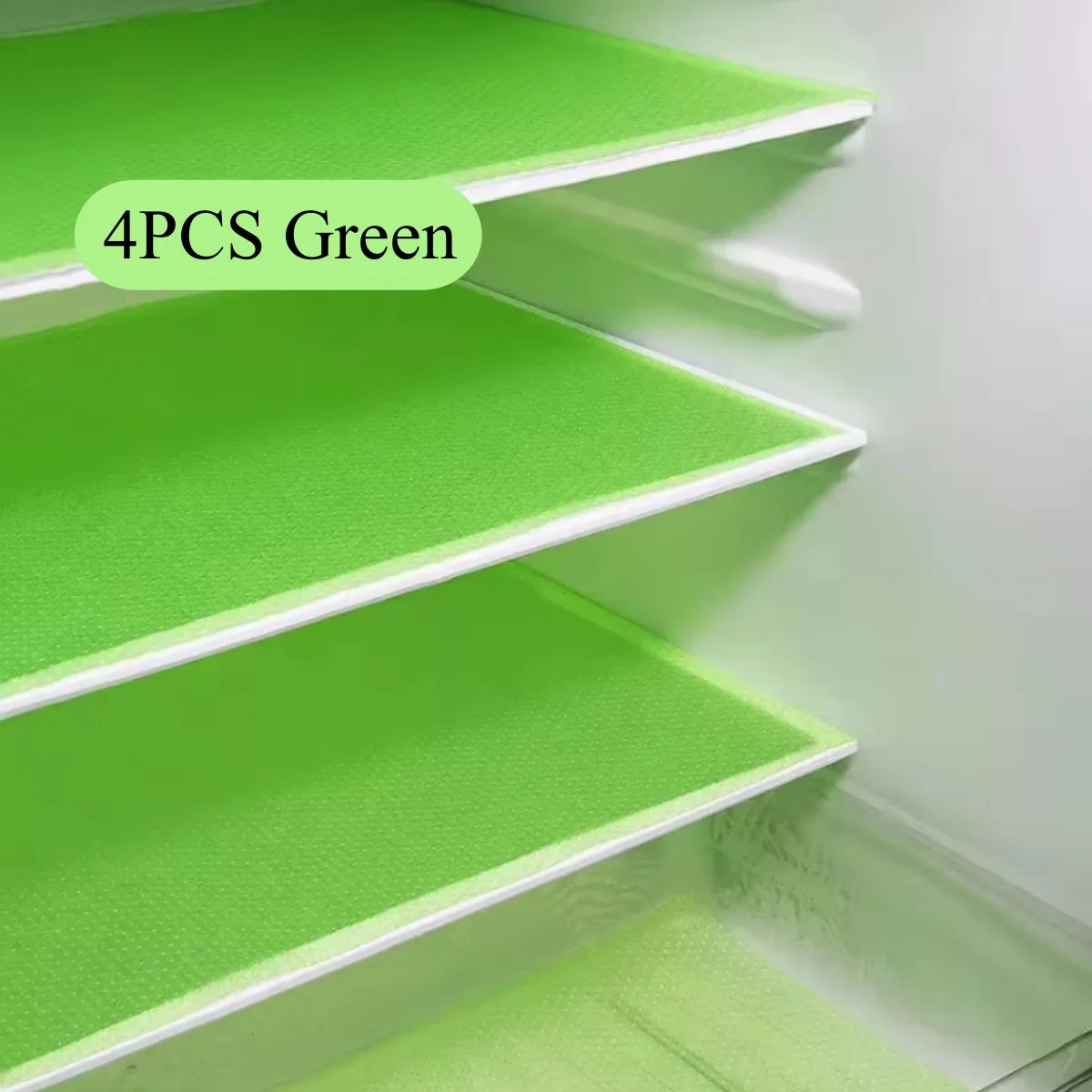 Four green cut-to-fit EVA fridge shelf liners installed in a refrigerator interior.