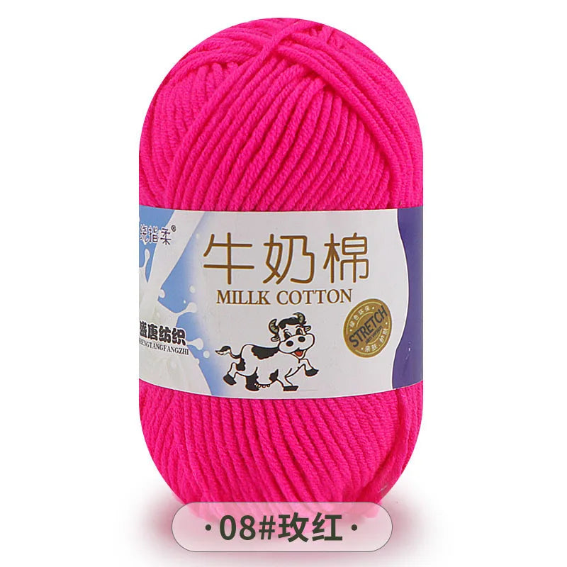 A skein of bright pink milk cotton blend yarn labeled for knitting and crochet projects.