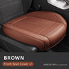 Brown front seat cover protector for a car seat, showing the leather material and stitching.