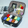 Portable faux leather sewing kit organizer with a black case featuring needles, scissors, and spools of colored thread.