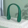 A green hands-free bladeless neck fan with a digital display resting on a white textured surface.