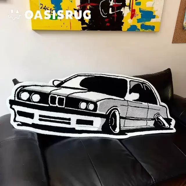 A black and white cartoon print plush carpet depicting a classic car on a black leather sofa.