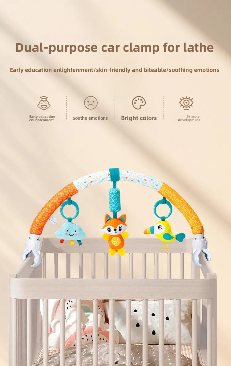A dual-purpose car clamp for lathe featuring an orange arch with hanging plush toys and charms.