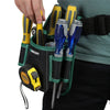 A hand is holding a black tool waist bag with a green belt and several yellow and blue tools for carpenters and electricians.