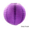 A purple round paper lantern with vertical folds.