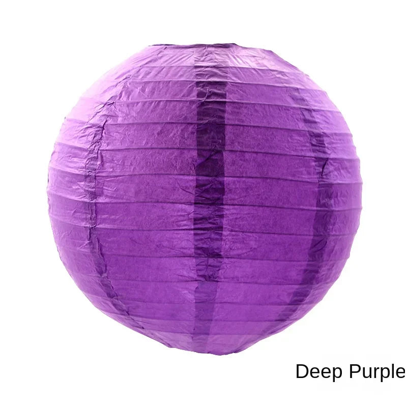 A purple round paper lantern with vertical folds.