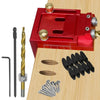 A red pocket hole jig kit for woodworking showing various tools including a jig, dowels, and nails on a wooden surface.