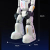 A white interactive robot with a blue light, shown standing upright against a dark background.