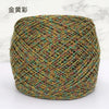 A ball of metallic silk crochet yarn with a gold and silver shimmer thread for knitting and macrame.