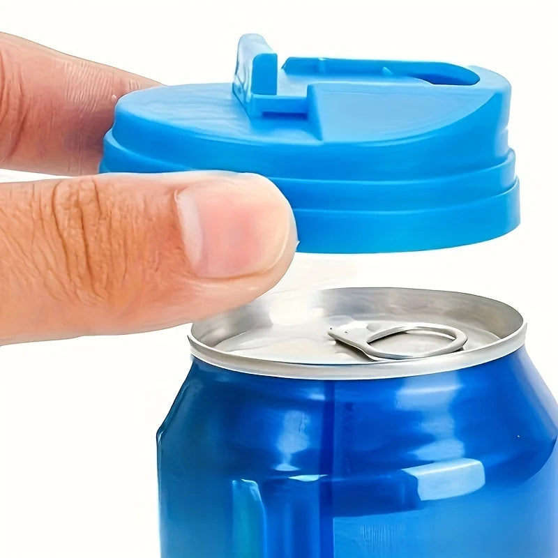 A hand is placing a blue reusable beverage can lid onto a blue aluminum can.