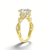 A gold filled moissanite wedding ring featuring a 3ct marquise cut diamond and nature-inspired gold setting.