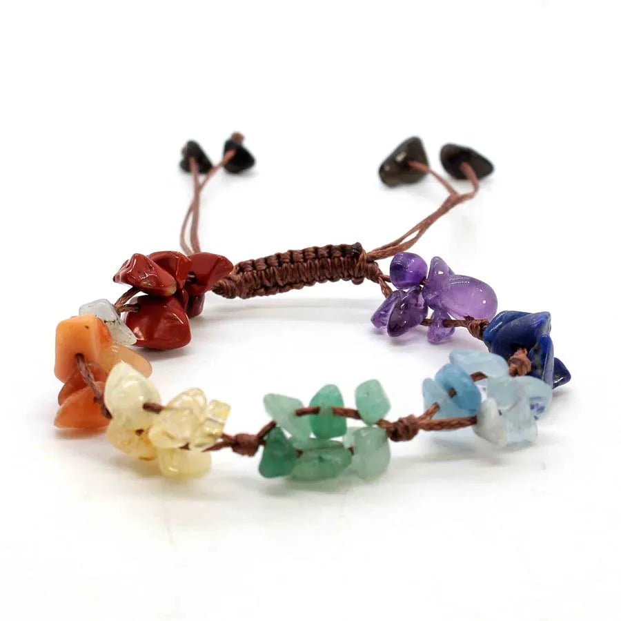 A set of braided crystal chip stone bracelets featuring various natural colored stones like amethyst and quartz.