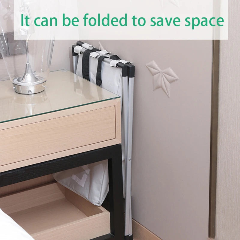 A foldable laundry basket with a black frame and white Oxford cloth is shown next to a glass table.