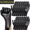 A hand wearing black disposable gloves is shown, with a pack of XL size gloves visible in the background.