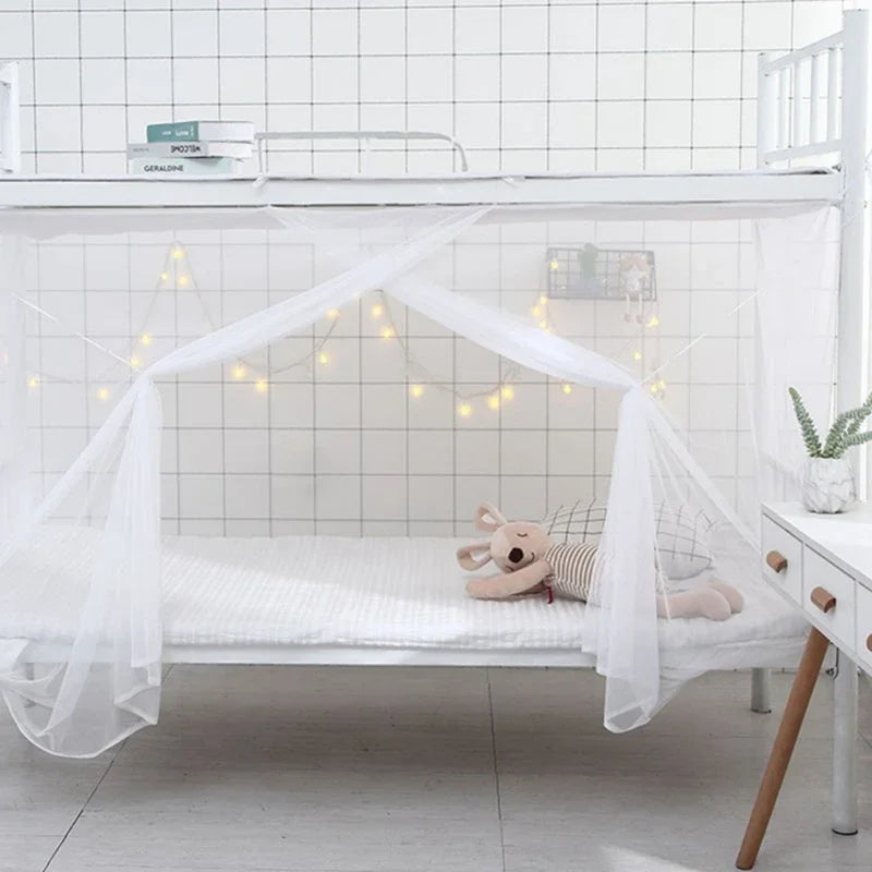A white princess-style lace canopy mosquito net draped over a bed frame with string lights.